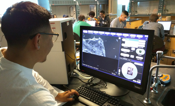 A Nanotechnology student at West Los Angeles College operating an Hitachi SEM.